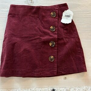 Burgundy skirt with buttons. New with tags